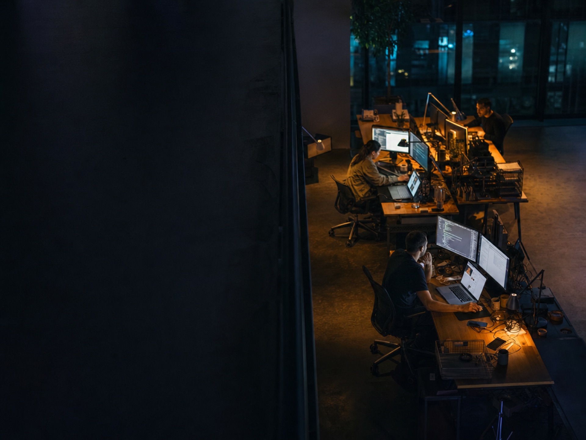 Tekdivyam Innovations engineering team working late in a dark office